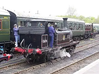 London, Brighton and South Coast Railway locomotive. Note the three pipes: one for the vacuum brake, one for the air brake, and one for the steam heat