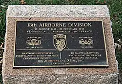 A color photograph of a stone plaque commemorating the soldiers of the 13th Airborne Division