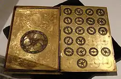 A cypher machine in the shape of a book, with arms of Henri II.