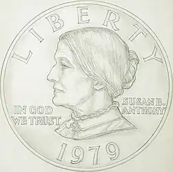A drawing of one side of a coin, depicting the profile of a woman