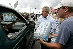 President George W. Bush helped deliver water at a relief center in Florida