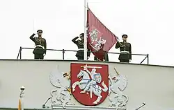 The presidential version of the coat of arms, as depicted on the Presidential Palace, and the flag of the president of Lithuania