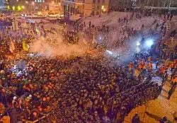 Protesters clashing with riot police on 11 December 2013