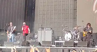 Stone Temple Pilots performing at Aftershock Festival in October 2023. From left to right: Robert DeLeo, Jeff Gutt, Eric Kretz, and Dean DeLeo.