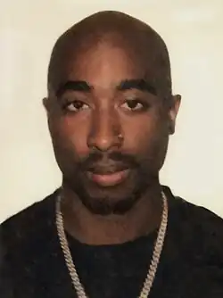 Headshot of Tupac Shakur on a white background