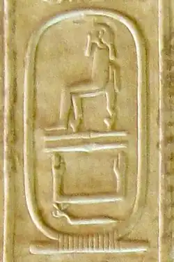 hieroglyphs inscribed on a yellow stone