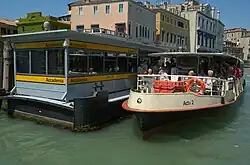 Water bus (vaporetto) at bus stop in Venice, Italy