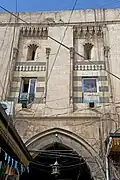 Interior façade of a gate from the courtyard of Khan al-Jumruk in Aleppo, Syria (1574)[2]