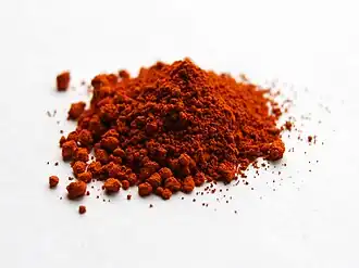 Alizarin was the first synthetic red dye, created by German chemists Carl Graebe and Carl Liebermann and head chemist Heinrich Caro in 1868 through the chemical company Badische Anilin-und Soda-Fabrik (BASF).[26] It duplicated the colorant in the madder plant, but was cheaper and longer lasting. After its introduction, the production of natural dyes from the madder plant virtually ceased.