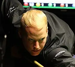 Allan Taylor playing a shot
