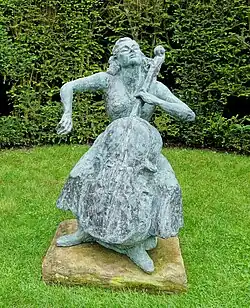 Statue of Amaryllis Fleming sitting and playing the cello