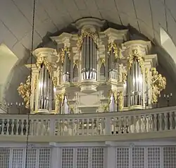 Color image of ornate organ in Germany associated with Bach
