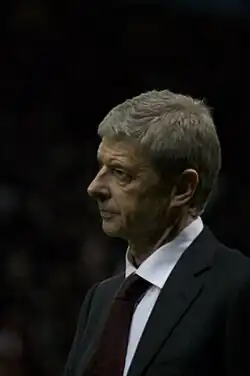 Arsène Wenger in suit and tie