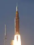 The two boosters being ignited, sending Artemis II into space.