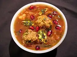 A bowl of ash-e anar, an Iranian soup made with pomegranate juice