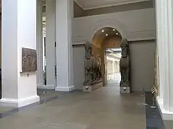Gallery view of Nimrud palace reliefs with lamassu sculptures