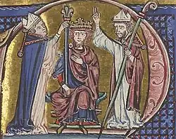 Two bishops standing by a bearded man sitting on a throne and wearing a crown