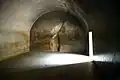 The Sudama Cave, in the Barabar Caves, has a large vaulted room with a polished granite finish and an inscription in the name of Ashoka.