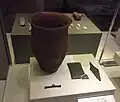 Beaker, wrist-guard with gold studs, copper dagger and toggle.[213]