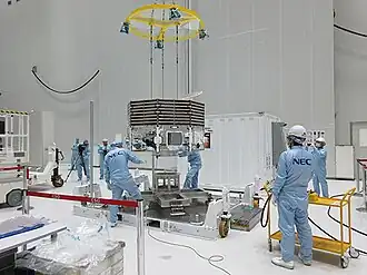 Mio being lifted from the container by a crane