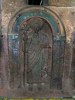 One of the seven life-size saints carved into the wall of the Church of Bet Golgotha, Lalibela, 15th century (traditionally believed to have been made during the reign of Gebre Mesqel Lalibela)[127]
