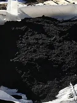 Biochar in a white tarp
