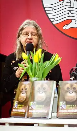 Biruté Galdikas shown speaking into a microphone