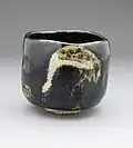 Black Raku tea bowl "Shōrei" (Aged Pine) with crane design, by Raku IX (Ryōnyū), Edo period (c. 1810–1838). Los Angeles County Museum of Art.