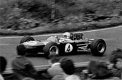 A mid-engined single-seater racing car with no aerodynamic wings