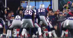 Brady receiving a snap, pictured from behind