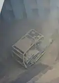 2. The bulldozer pushes cargo to the center of the hold.