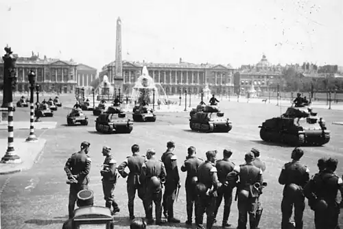 Captured French SOMUA S35 in German service parade on the square in 1941