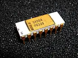 16-pin white ceramic DIP on black foam labeled with Intel logo and C4004