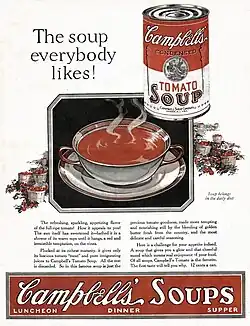 A print ad showing a red and white can of Campbell's Tomato Soup above and to the right of a bowl of soup. Below that is a written advertisment with a red and white Campbell's Soup Can banner at the bottom