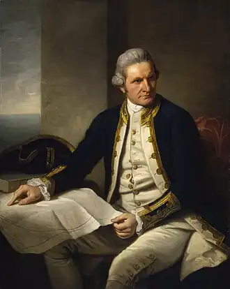 James Cook, wearing a naval uniform, sitting at a table, looking at a map of the world