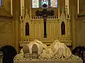 Altar crucifix featuring a cross made of black granite from the Tijuca Forest,[38] situated behind the tomb of Emperor Pedro II of Brazil and Empress Teresa Cristina in the Cathedral of Petrópolis