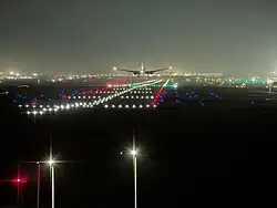 Cathay Pacific Boeing 777-300ER moments before touchdown at IGI Airport's Runway 29R.