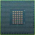 The underside of the 90&nbsp;nm Cell/B.E. processor showing its 1242 solder balls, each 0.6&nbsp;mm in diameter, and its array of 35 capacitors