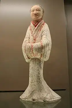 A ceramic female servant wearing Hanfu silk robes