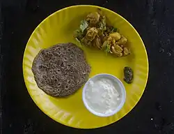 Buckwheat bread (roti) with potato veg and sour curd, Sikkim, India