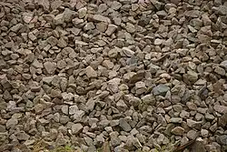Irregularly cut brown stones with edges
