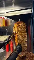Chicken shawarma on a vertical rotisserie