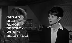 Still shot from the film "The Children's Hour", showing Shirley MacLaine looking down at the left and Audrey Hepburn to her right staring at her, in a bedroom. The words "Can an ugly rumor destroy what's beautiful?" obscure much of MacLaine's face.