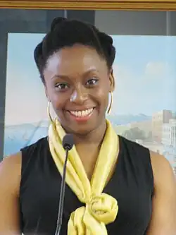 A picture of a woman smiling directly at the camera.
