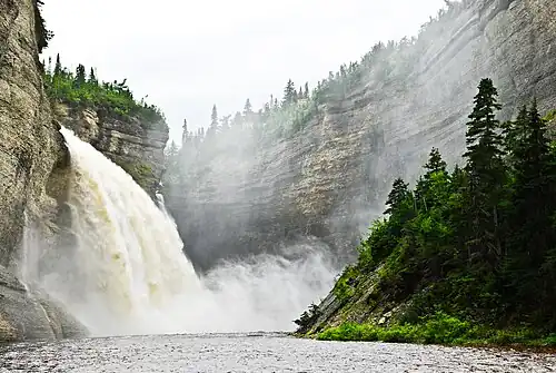 Cliff wall, fall and Vauréal River[39]