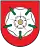 A coat of arms depicting orange tools on a white background on the top and an orange sun on a dark green background on the bottom