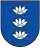 A coat of arms depicting three white flowers lined up vertically with four yellow seeds surrounding each all on a blue background