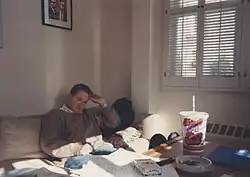 An old photo of Conan O'Brien sitting on a couch