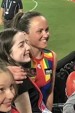 Pearce posing for a photo with fans after a match