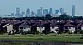 Suburban Dallas, Texas, (in the foreground)